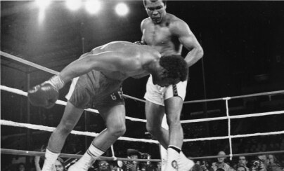 Challenger Muhammad Ali watches as defending world champion George Foreman goes down to the canvas in the eighth round of their WBA/WBC championship match in Kinshasa, Zaire, on October 30, 1974. Foreman is counted out by the referee and Ali regains the world heavyweight crown by KO in the bout dubbed 'Rumble in the Jungle.' (AP Photo)